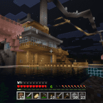 Minecraft waterside fortress with docks, lanterns, and layered design at night in the VIG Realm.
