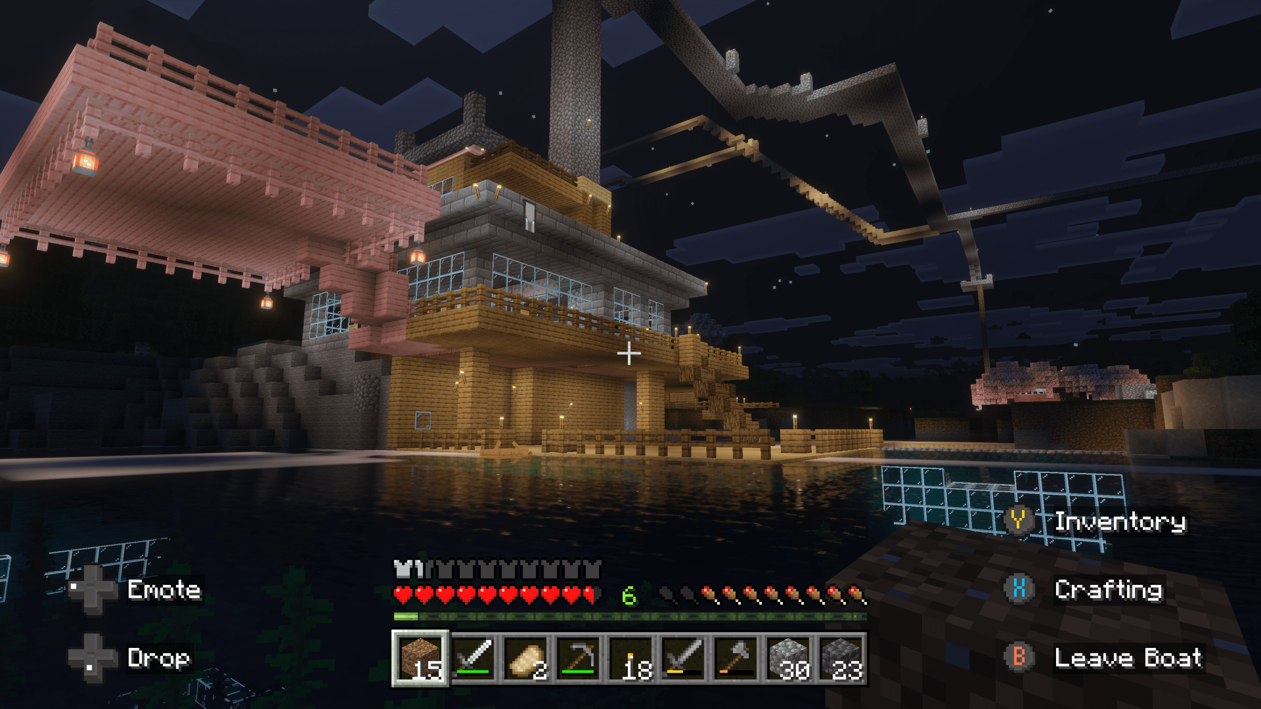 Minecraft waterside fortress with docks, lanterns, and layered design at night in the VIG Realm.